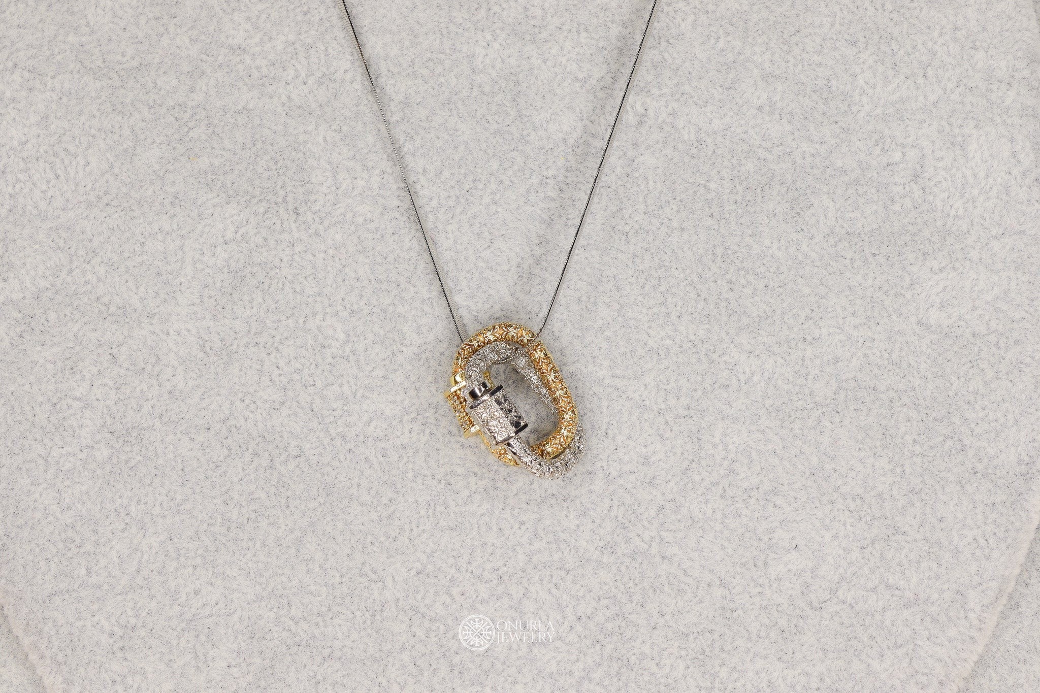Onurla men's necklace with interlocking gold and silver carabiner pendants, fully encrusted with zircon stones on a fine snake chain.